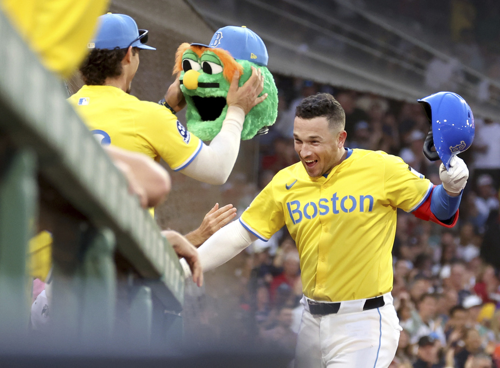 Boston Red Sox's Alex Bregman, right, celebrates after his home run during the fifth inning of a baseball game against the New York Yankees, Saturday, Sept. 13, 2025, in Boston. (AP Photo/Mark Stockwell)