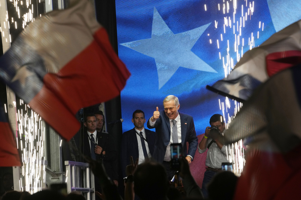 Presidential candidate Jose Antonio Kast, of the opposition Republican Party, celebrates winning the presidential runoff election in Santiago, Chile, Sunday, Dec. 14, 2025. (AP Photo/Esteban Felix)