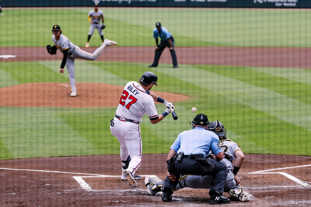 Atlanta Braves' Austin Riley (27) strikes out with the based loaded against Pittsburgh Pirates pitcher Mason Montgomery, left, during the first inning of a baseball game, Sunday, June 7, 2026, in Atlanta. (AP Photo/Erik S. Lesser)