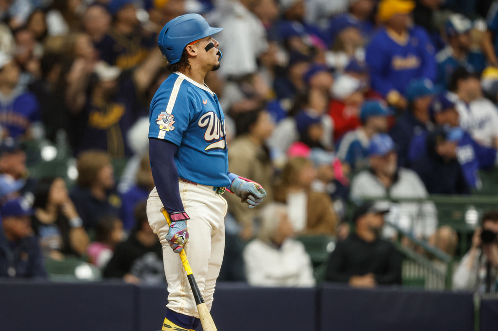 Milwaukee Brewers' William Contreras watches his three-run home run during the first inning of a baseball game against the Los Angeles Dodgers, Friday, May 22, 2026, in Milwaukee. (AP Photo/Jeffrey Phelps)