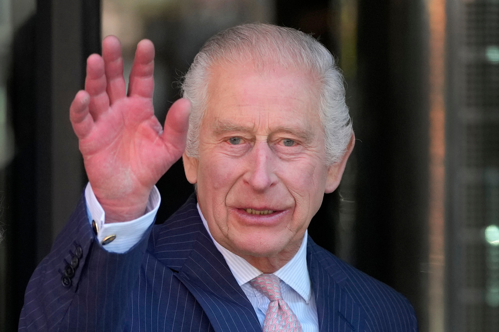 FILE -Britain's King Charles III waves as he arrives for a visit to University College Hospital Macmillan Cancer Centre in London, Tuesday, April 30, 2024. (AP Photo/Kin Cheung, File)