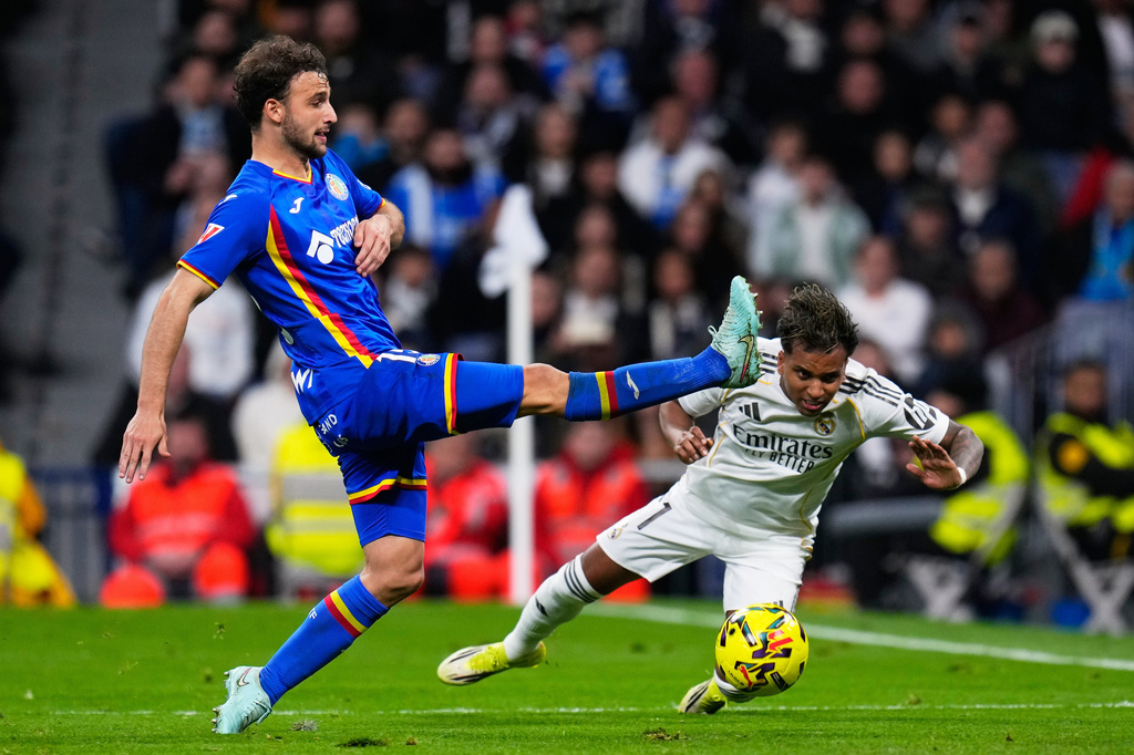 FILE - Getafe's Boselli fights for the ball against Real Madrid's Rodrygo during a Spanish La Liga soccer match between Real Madrid and Getafe in Madrid, Spain, March 2, 2026. (AP Photo/Manu Fernandez, File)
