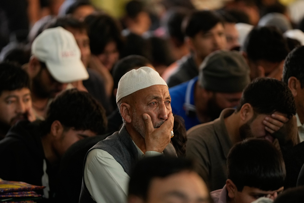 Shiite Muslims mourn the killing of Iranian Supreme Leader Ayatollah Ali Khamenei during a special prayer in Jammu, India, Sunday, March 1, 2026. (AP Photo/Channi Anand)
