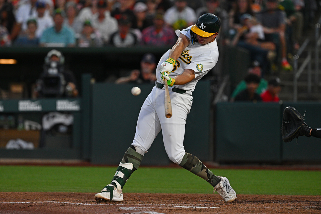Athletics' Nick Kurtz (16) connects for a three-run home run in the fifth inning of a baseball game against the San Francisco Giants the in West Sacramento, Calif., Friday, May 15, 2026. (Jose Carlos Fajardo/Bay Area News Group via AP)
