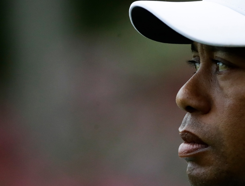 FILE - Tiger Woods walks off the 13th hole during the second round at the Masters golf tournament, April 6, 2018, in Augusta, Ga. (AP Photo/Chris Carlson, File)