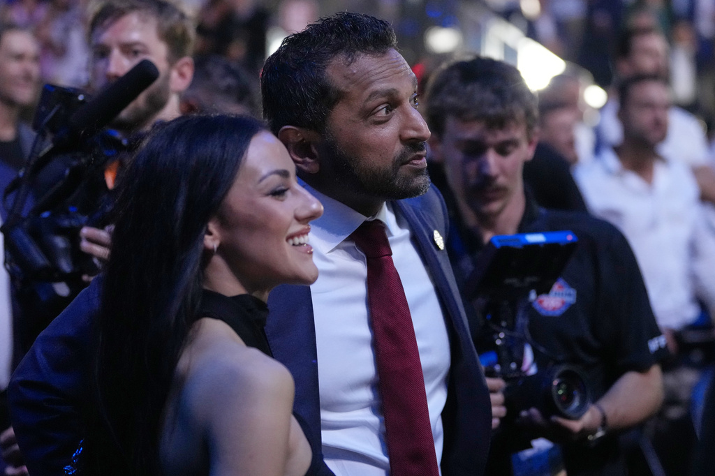 FBI director Kash Patel watches with Alexis Wilkins at UFC Freedom 250 on the South Lawn of the White House, Monday, June 15, 2026, in Washington. (AP Photo/Alex Brandon)