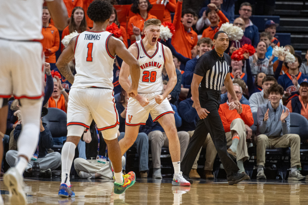 Virginia forward Thijs de Ridder (28)celebrates after basket against Stanford during the first half of an NCAA college basketball game, Saturday, Jan. 10, 2026, in Charlottesville, Va. (AP Photo/Robert Simmons)