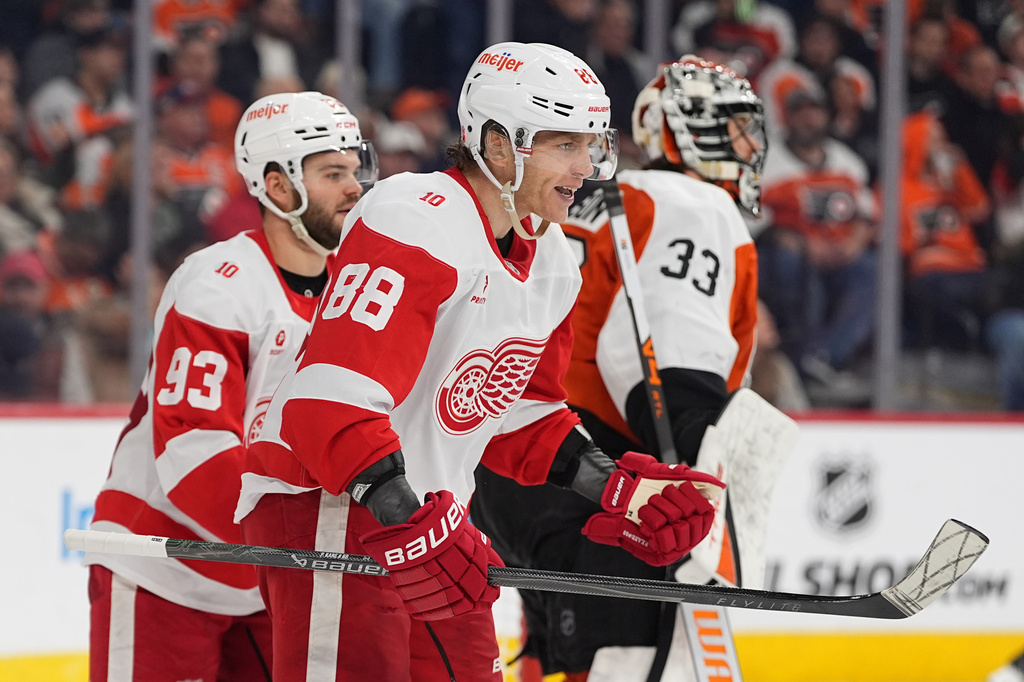 Detroit Red Wings' Patrick Kane (88) reacts after he scored past Philadelphia Flyers goaltender Samuel Ersson (33) during the third period of an NHL hockey game, Thursday, April 2, 2026, in Philadelphia. (AP Photo/Matt Rourke)