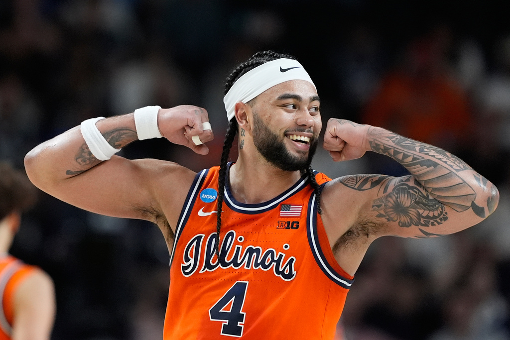 Illinois guard Kylan Boswell (4) celebrates a basket during the first half in the second round of the NCAA college basketball tournament against Virginia Commonwealth, Saturday, March 21, 2026, in Greenville, S.C. (AP Photo/Brynn Anderson)