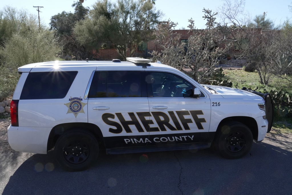 A Pima county sheriff's vehicle is parked out front of Nancy Guthrie’s home on Sunday, Feb. 8, 2026 in Tucson, Ariz. (AP Photo/Ty ONeil)