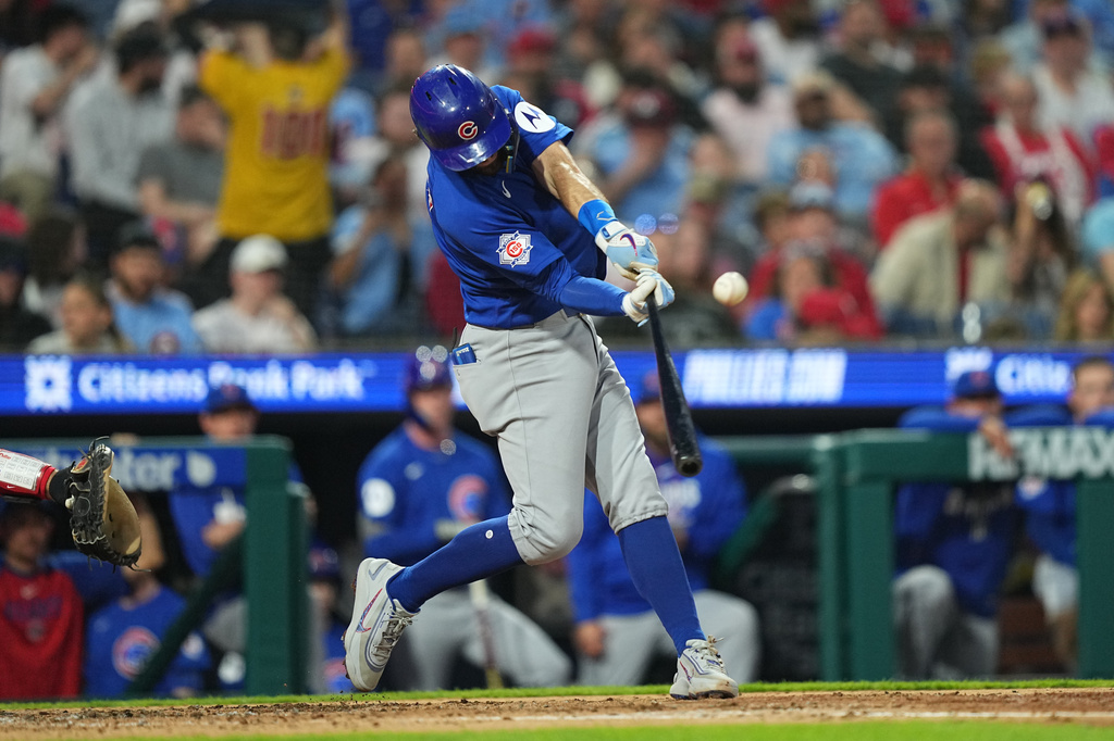 Chicago Cubs' Dansby Swanson hits a two-run home run off Philadelphia Phillies pitcher Cristopher Sánchez during the fourth inning of a baseball game, Monday, April 13, 2026, in Philadelphia. (AP Photo/Matt Rourke)