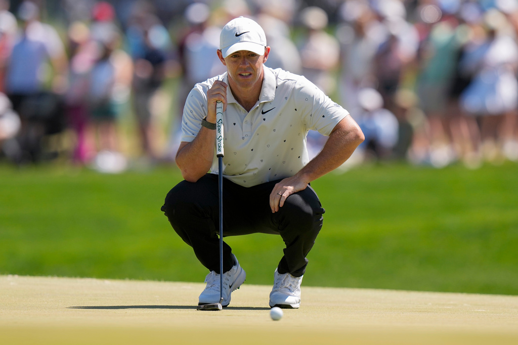 Rory McIlroy, of Northern Ireland, lines up his shot on the 16th green during the third round of the PGA Championship golf tournament at Aronimink Golf Club, Saturday, May 16, 2026, in Newtown Square, PA. (AP Photo/Frank Franklin II)