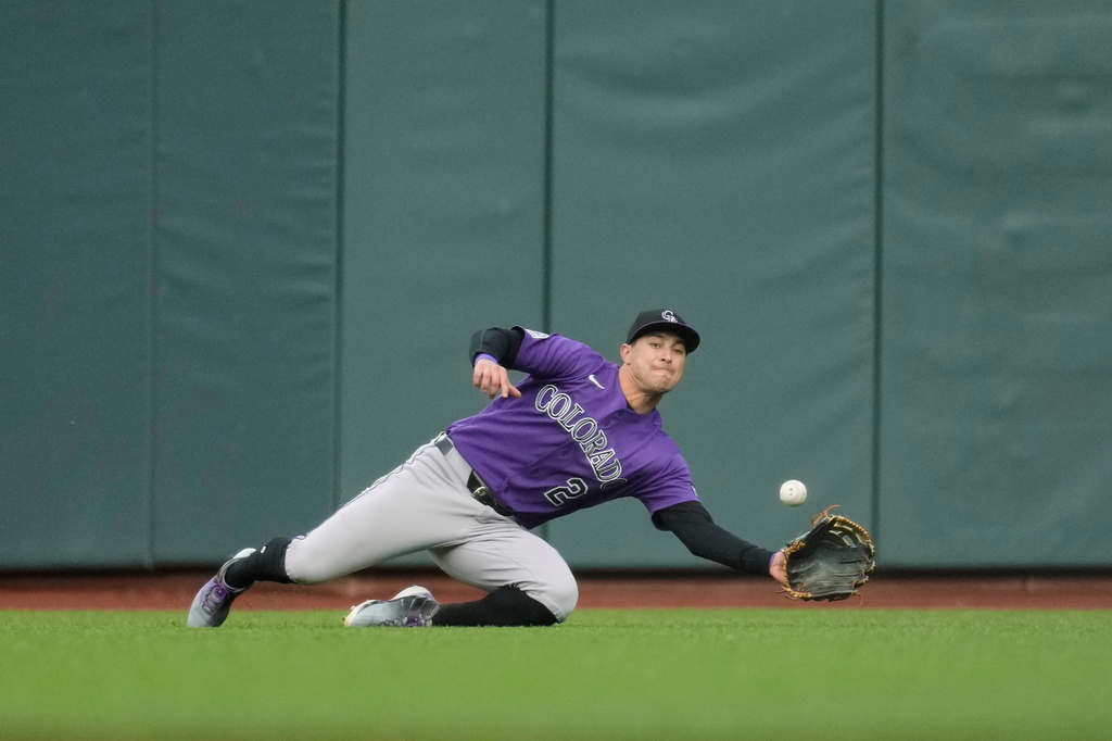 Colorado Rockies right fielder Tyler Freeman cannot catch a single hit by San Francisco Giants' Jung Hoo Lee during the second inning of a baseball game, Friday, July 10, 2026, in San Francisco. (AP Photo/Jeff Chiu)