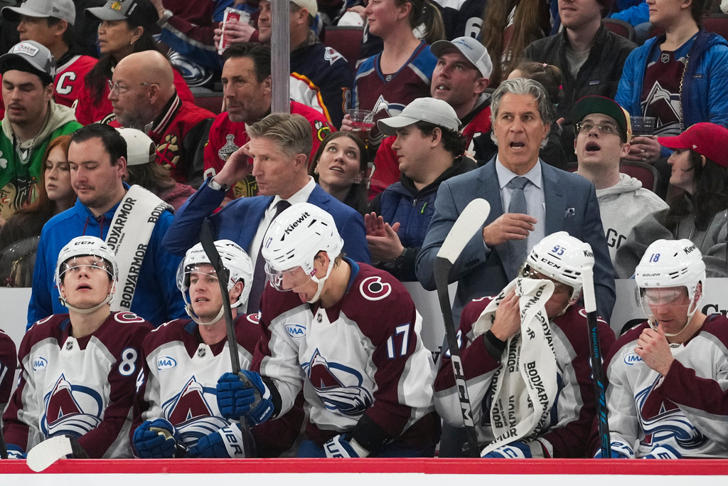 Colorado Avalanche head coach Jared Bednar, right, stands on the bench during the second period of an NHL hockey game against the Chicago Blackhawks, Friday, March 20, 2026, in Chicago. (AP Photo/Erin Hooley)