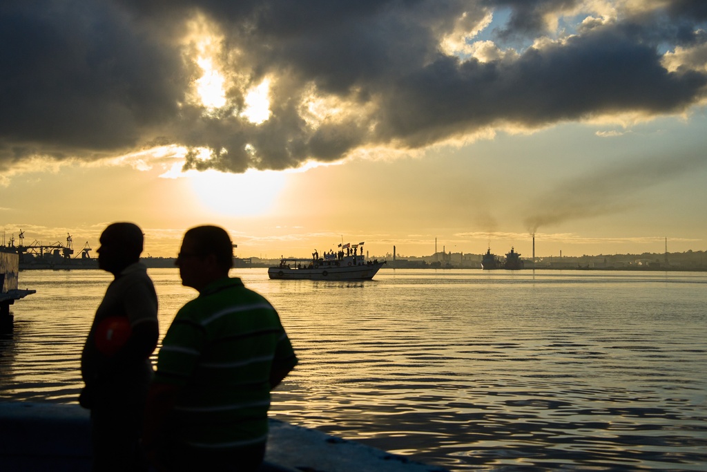 The vessel Maguro, behind, arrives from Mexico with humanitarian aid as part of the "Nuestra America," or Our America Convoy, in Havana Bay, Cuba, Tuesday, March 24, 2026. (AP Photo/Ramon Espinosa)