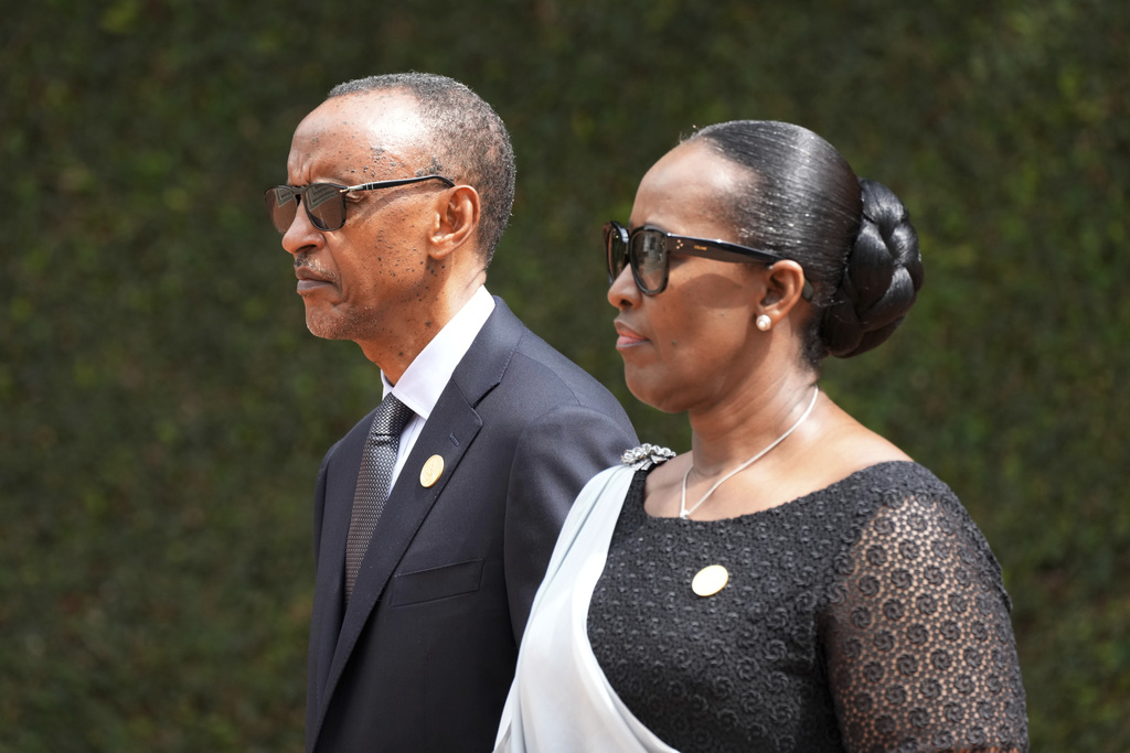 FILE - Rwandan President Paul Kagame, left, and his wife, first lady Jeannette Kagame arrive for a ceremony to mark the 30th anniversary of the Rwandan genocide, held at the Kigali Genocide Memorial, in Kigali, Rwanda, Sunday, April 7, 2024. (AP Photo/Brian Inganga, File)