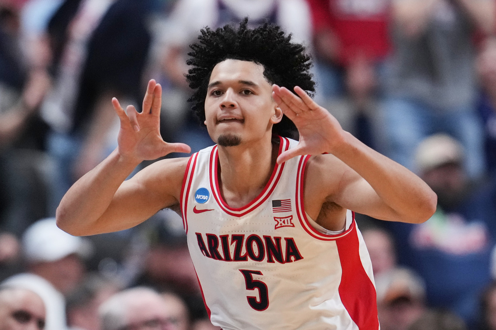 Arizona guard Brayden Burries (5) celebrates after scoring during the second half in the Sweet 16 of the NCAA college basketball tournament against Arkansas, Thursday, March 26, 2026, in San Jose, Calif. (AP Photo/Godofredo A. Vásquez)