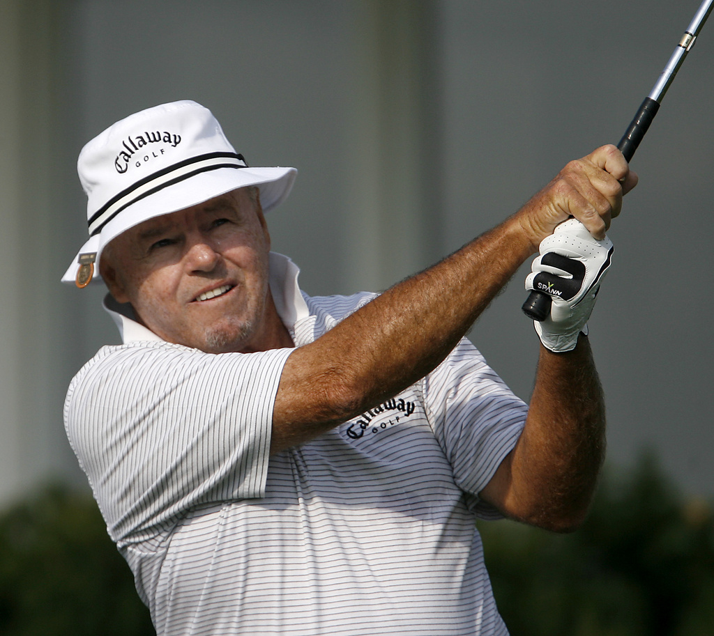 FILE - Jim Colbert watches his drive on the tenth hole during the opening round of the 2006 U.S. Senior Open Championship golf tournament at Prairie Dunes Country Club in Hutchinson, Kan., July 6, 2006. (AP Photo/Larry Smith,File)