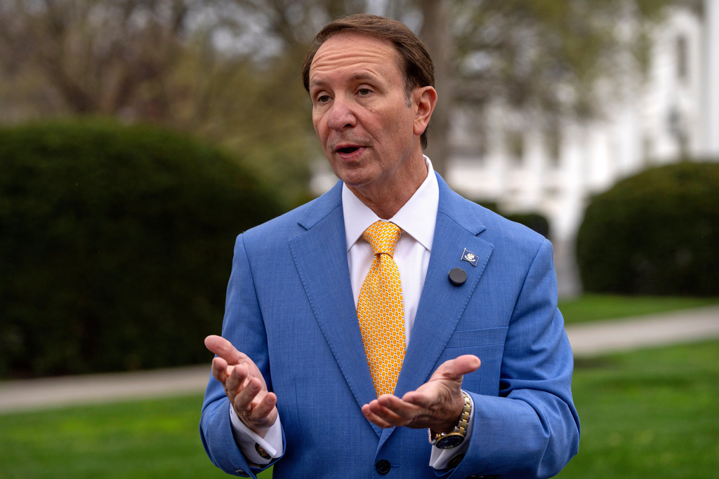 FILE - Louisiana Gov. Jeff Landry records a social media video outside the White House, March 24, 2025, in Washington. (AP Photo/Mark Schiefelbein, file)