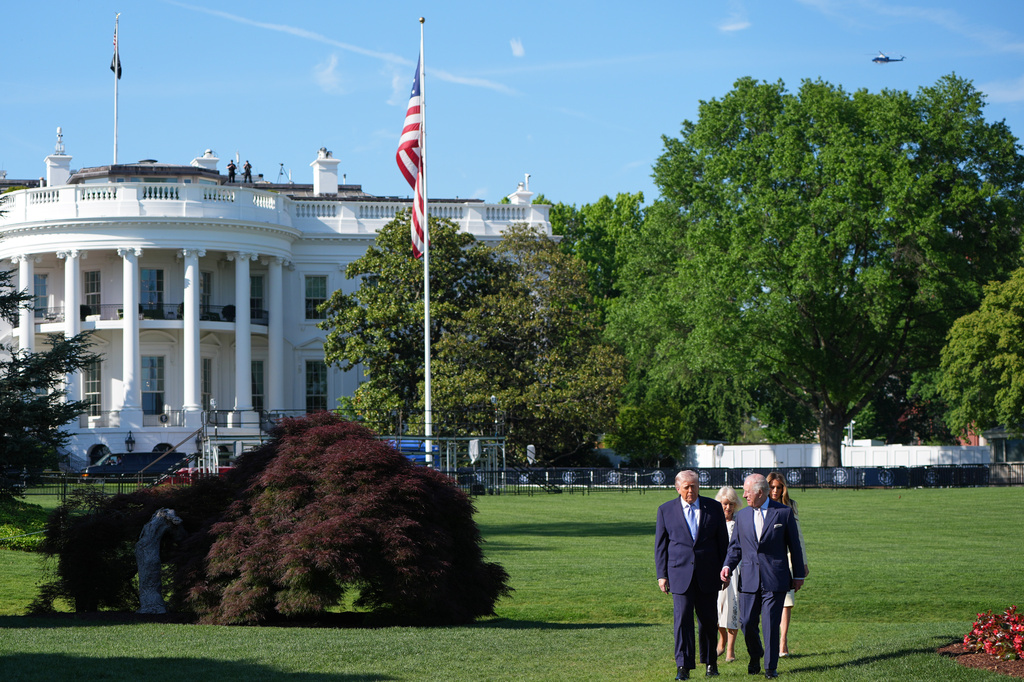 President Donald Trump and first lady Melania Trump along with Britain's King Charles III and Queen Camilla walk on the South Lawn to visit the White House garden and bee hive at the White House, Monday, April 27, 2026, in Washington. (AP Photo/Alex Brandon, Pool)