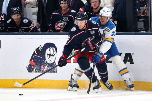 Columbus Blue Jackets forward Charlie Coyle, left, reaches for the puck in front of St. Louis Blues forward Brayden Schenn during the first period of an NHL hockey game in Columbus, Ohio, Saturday, Nov. 1, 2025. (AP Photo/Paul Vernon) Columbus Blue Jackets forward Charlie Coyle, left, reaches for the puck in front of St. Louis Blues forward Brayden Schenn during the first period of an NHL hockey game in Columbus, Ohio, Saturday, Nov. 1, 2025. (AP Photo/Paul Vernon)
