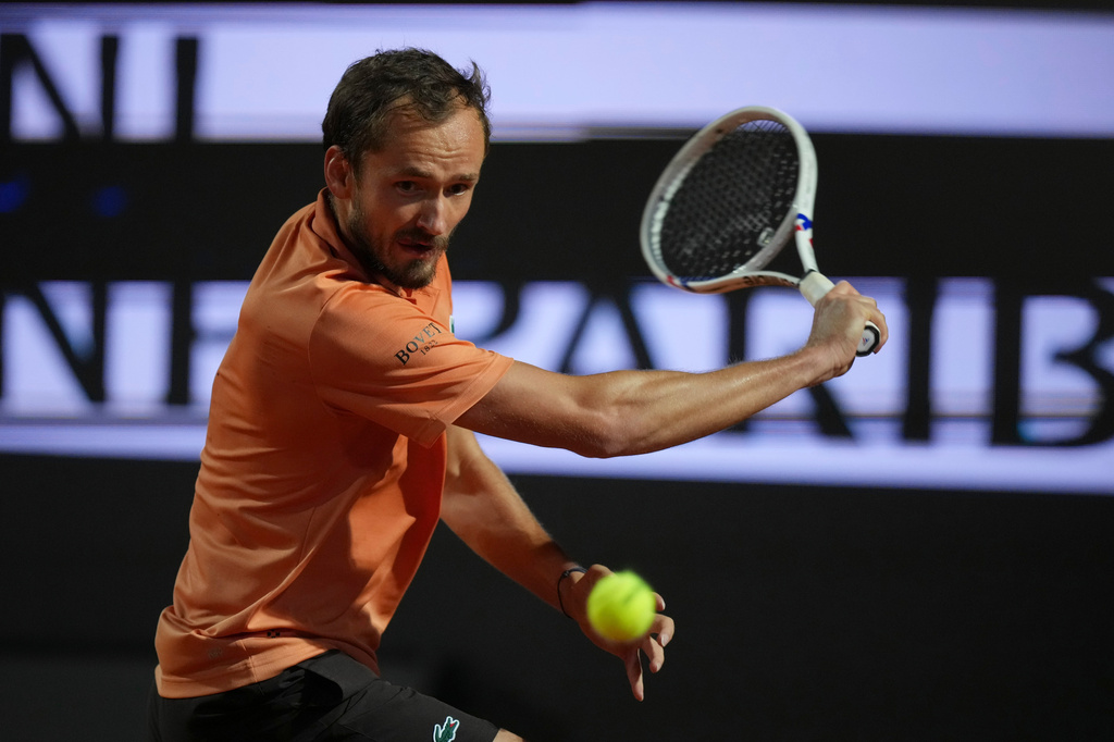 Daniil Medvedev of Russia returns a ball to Italy's Jannik Sinner during their semifinal match at the Italian Open tennis tournament in Rome, Friday, May 15, 2026. (AP Photo/Andrew Medichini)