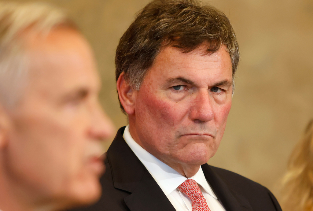 Canada-U.S. Trade Minister Dominic LeBlanc listens as Prime Minister Mark Carney speaks about Canada's response to new U.S. tariffs during a news conference on Parliament Hill in Ottawa on Saturday, Aug. 22, 2026. (Patrick Doyle/The Canadian Press via AP)