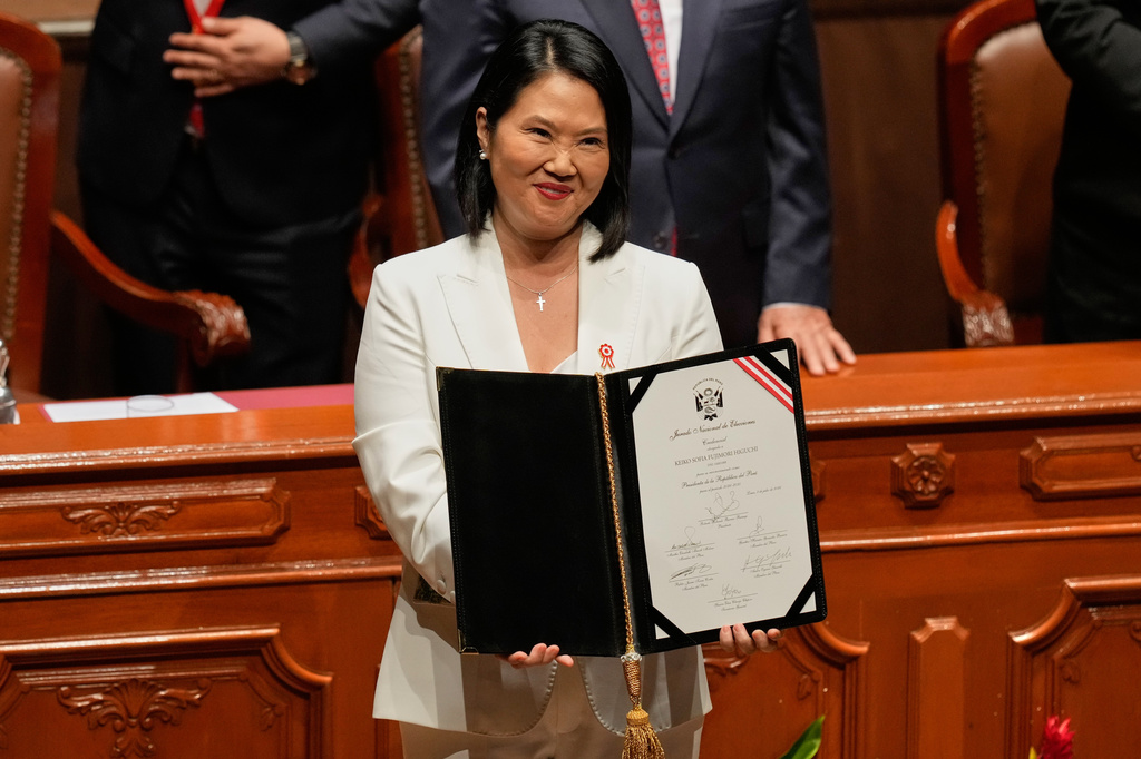 Peruvian President-elect Keiko Fujimori shows her credentials from the National Elections Board during a ceremony in Lima, Peru, Wednesday, July 15, 2026. (AP Photo/Martin Mejia)