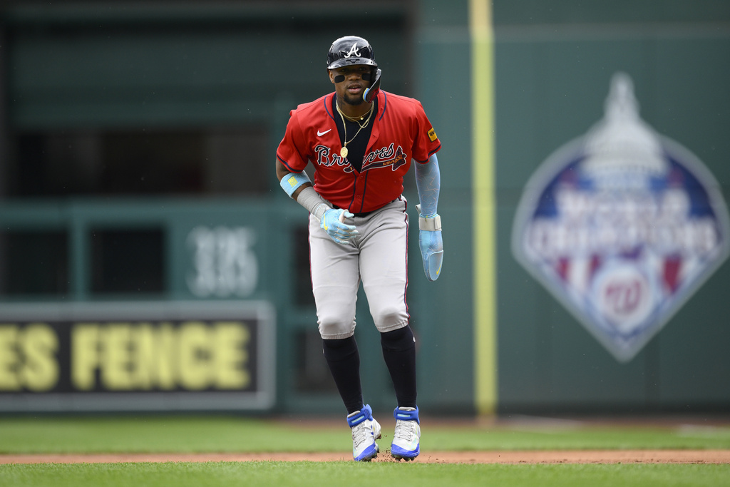 Atlanta Braves' Ronald Acuña Jr. takes a lead from first base during the first inning of the first baseball game of a doubleheader against the Washington Nationals, Tuesday, Sept. 16, 2025, in Washington. (AP Photo/Nick Wass)