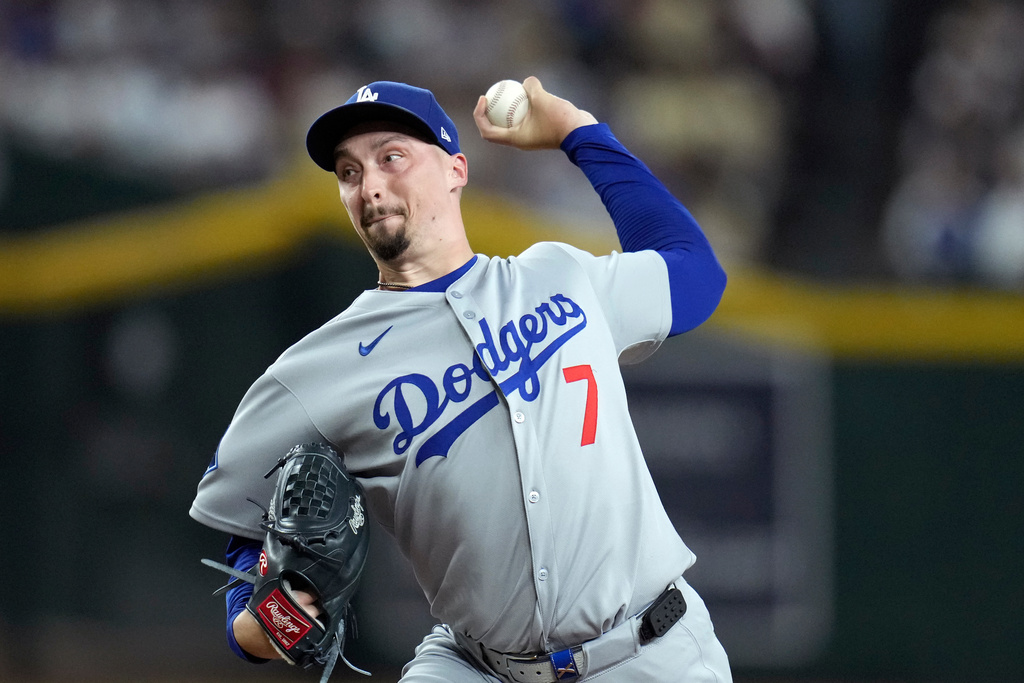 Los Angeles Dodgers starting pitcher Blake Snell throws against the Arizona Diamondbacks during the first inning of a baseball game Wednesday, Sept. 24, 2025, in Phoenix. (AP Photo/Ross D. Franklin)