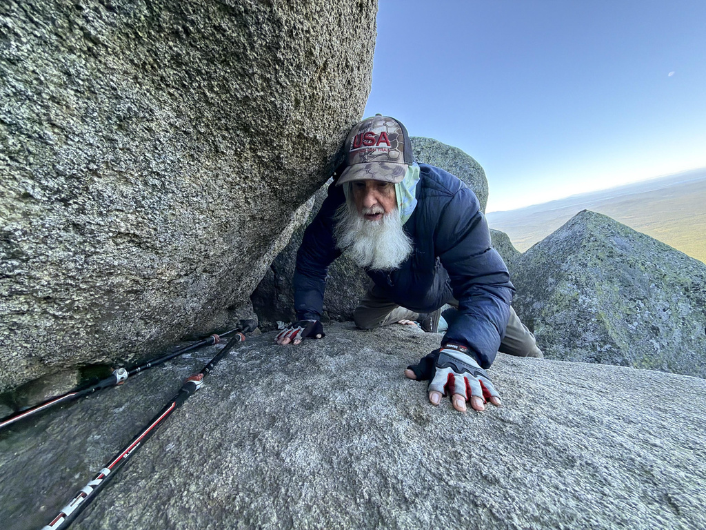 Dale Sanders, 91, climbs a section of Mt. Katahdin, Monday, Aug. 31, 2026 in Baxter State Park in Piscataquis County, Maine. (AP Photo/Robert F. Bukaty)
