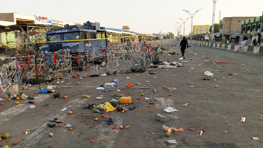 A security person patrols at the scene of Monday's bomb blast at a market in Maiduguri, Nigeria, Tuesday, March 17, 2026. (AP Photo/Jossy Ola )