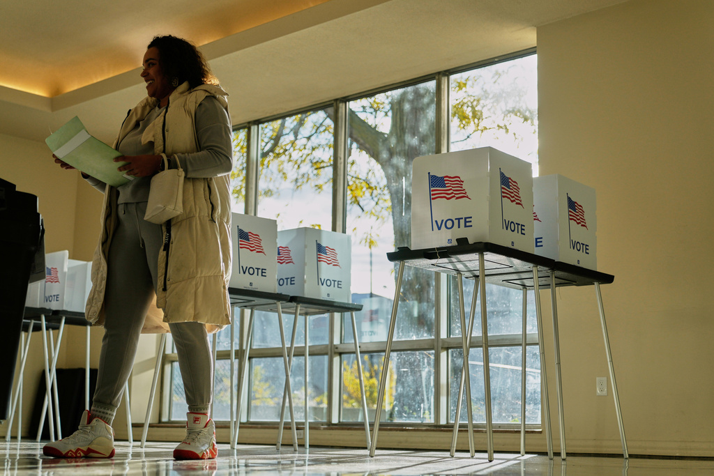 FILE - People wait to cast their ballot at the Horatio Williams Foundation in downtown Detroit, Tuesday, Nov. 4, 2025. (AP Photo/Ryan Sun,File)