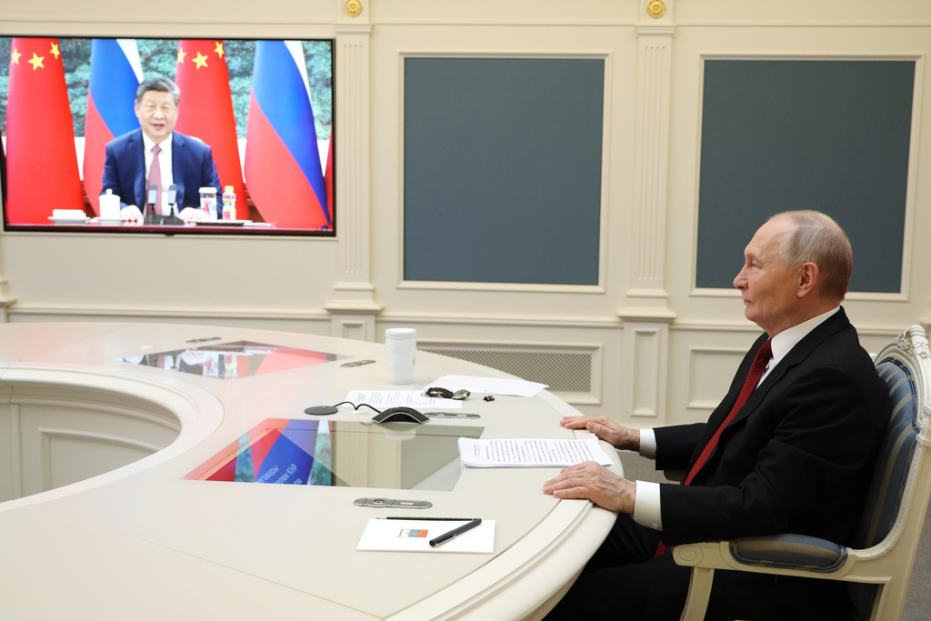 Russian President Vladimir Putin speaks with Chinese President Xi Jinping via videoconference at the Kremlin in Moscow, Wednesday, Feb. 4, 2026. (Vyacheslav Prokofyev/Sputnik, Kremlin Pool Photo via AP)