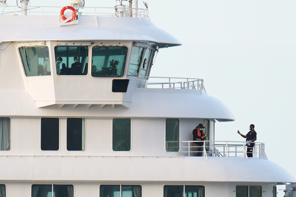 Passengers and crew at the hantavirus-stricken cruise ship MV Hondius after arriving at the port of Granadilla in Tenerife, Canary Islands, Spain, Sunday, May 10, 2026. (AP Photo/Manu Fernandez)