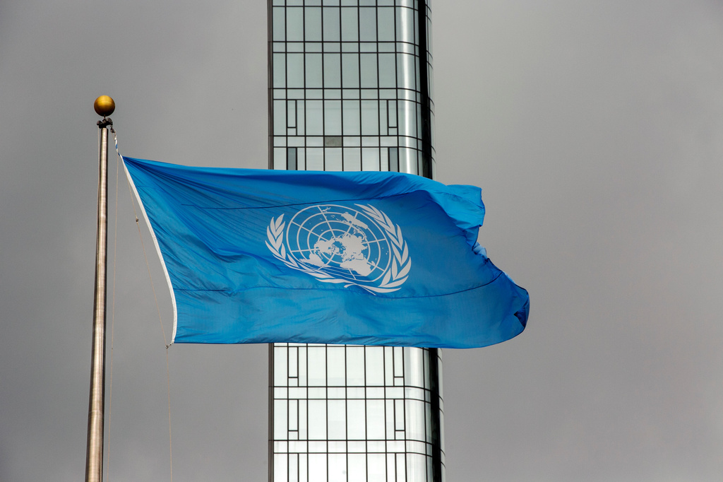 FILE - The UN flag flies on a stormy day at the United Nations during the United Nations General Assembly, Sept. 22, 2022. (AP Photo/Ted Shaffrey, File)