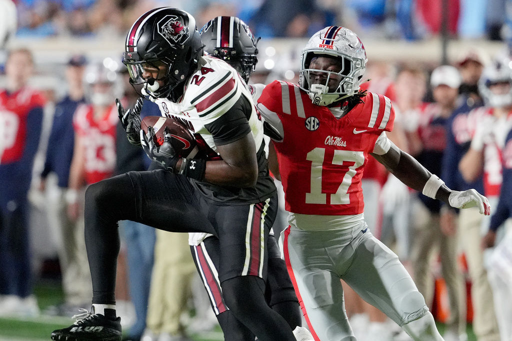 South Carolina defensive back Jalon Kilgore (24) intercepts a pass intended for Mississippi wide receiver Winston Watkins (17) during the first half of an NCAA college football game, Saturday, Nov. 1, 2025, in Oxford, Miss. (AP Photo/Rogelio V. Solis)