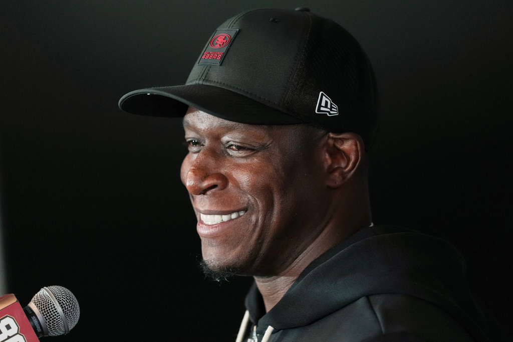 FILE - San Francisco 49ers defensive coordinator Raheem Morris speaks to the media ahead of practice, Sept. 8, 2026, in Melbourne, Australia. (AP Photo/Asanka Brendon Ratnayake, File)