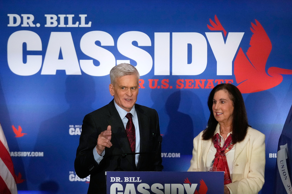 Sen. Bill Cassidy, R-La., left, speaks to supporters alongside his wife, Laura, during an election night watch party Saturday, May 16, 2026, in Baton Rouge, La. (AP Photo/Gerald Herbert)