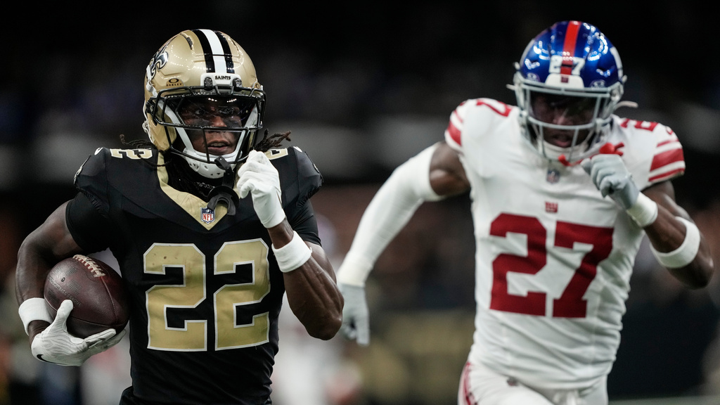 New Orleans Saints wide receiver Rashid Shaheed (22) runs after a catch for a touchdown against New York Giants safety Tyler Nubin (27) in the first half of an NFL football game, Sunday, Oct. 5, 2025, in New Orleans. (AP Photo/Gerald Herbert)