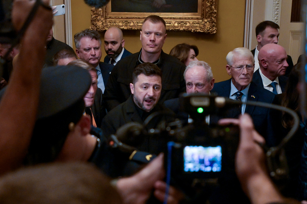 Ukraine's President Volodymyr Zelenskyy, center, speaks to reporters at the U.S. Capitol with from left: Sen. Richard Blumenthal, D-Conn., Sen. James Risch, R-Idaho, Sen. Roger Wicker, R-Miss., and Sen. Mark Kelly, D-Ariz., following a meeting of bipartisan leaders of the Lindsey O. Graham Sanctioning Russia and Iran Act of 2026, Tuesday, July 28, 2026, in Washington. (AP Photo/Rod Lamkey, Jr.)