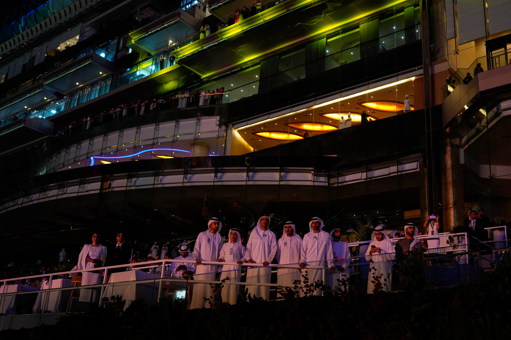 Emirati men watch Dubai World Cup horse races closing ceremony at Meydan Racecourse in Dubai, United Arab Emirates, Saturday, March 28, 2026. (AP Photo/Altaf Qadri)