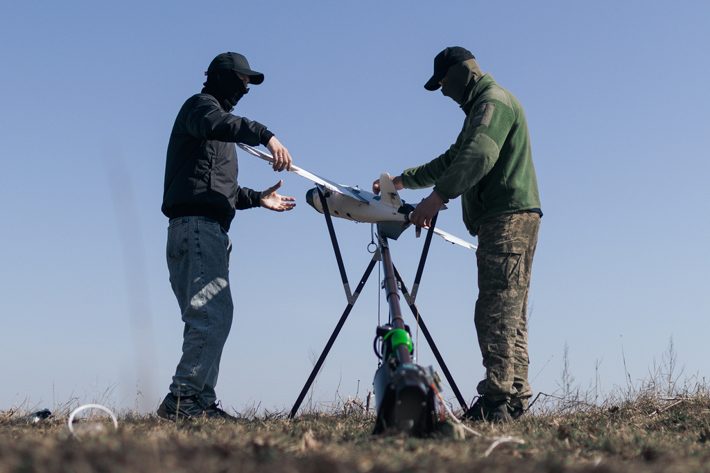 Soldiers of the 127th Separate Territorial Brigade launch a drone to search for Russian attack drones at the front line in the Kharkiv region Friday, March 13, 2026. (AP Photo/Nikoletta Stoyanova)