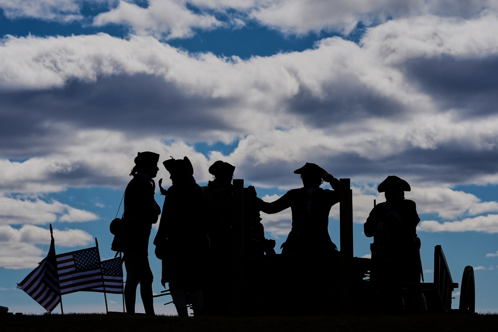 Reenactors stand atop Dorchester Heights in an Evacuation Day ceremony marking the 1776 departure of British troops from the city during the American Revolutionary War, Tuesday, March 17, 2026, in Boston. (AP Photo/Robert F. Bukaty)