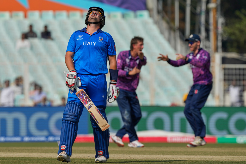 Italy's Benjamin Manenti leaves the ground after losing his wicket during the T20 World Cup cricket match between Italy and Scotland in Kolkata, India, Monday, Feb. 9, 2026. (AP Photo/Bikas Das)