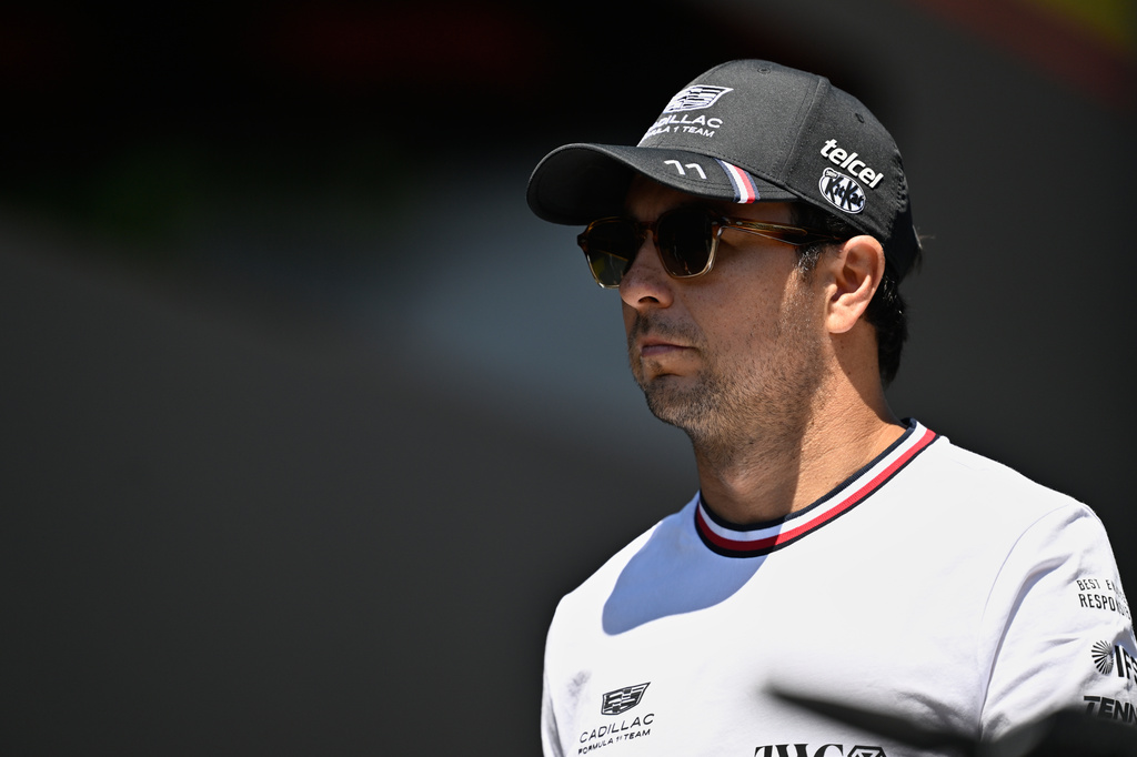 Cadillac driver Sergio Perez of Mexico walks through the paddock as he arrives for the Austrian F1 Grand Prix, in Spielberg, Austria, Thursday, June 25, 2026. (AP Photo/Denes Erdos)