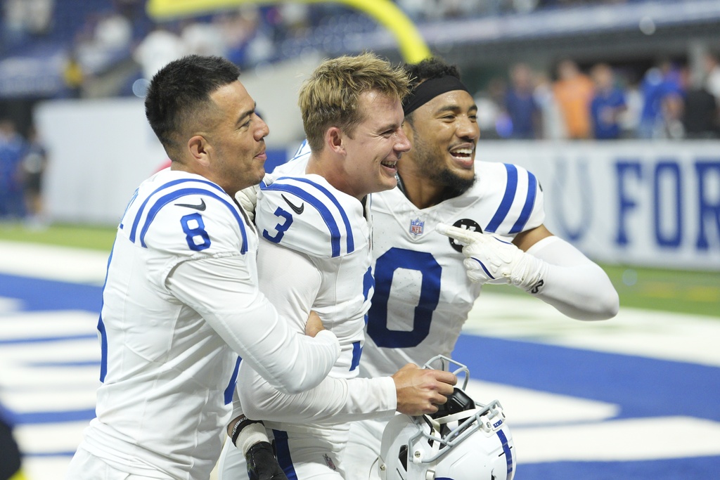 Indianapolis Colts place kicker Spencer Shrader (3) celebrates Sith Rigoberto Sanchez (8) and Cam Bynum (0) after Schrader kicked a game winning field goal during the second half an NFL football game against the Denver Broncos, Sunday, Sept. 14, 2025, in Indianapolis. (AP Photo/AJ Mast)