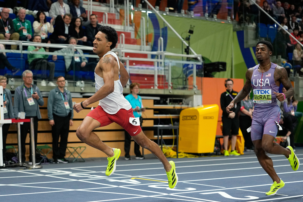 Christopher Morales Williams, of Canada, crosses the finish line to win the gold medal, ahead of silver medalist Khaleb McRae, of the United States, in the men's 400 meters final at the World Athletics Indoor Championships in Torun, Poland, Saturday, March 21, 2026.(AP Photo/Matthias Schrader)