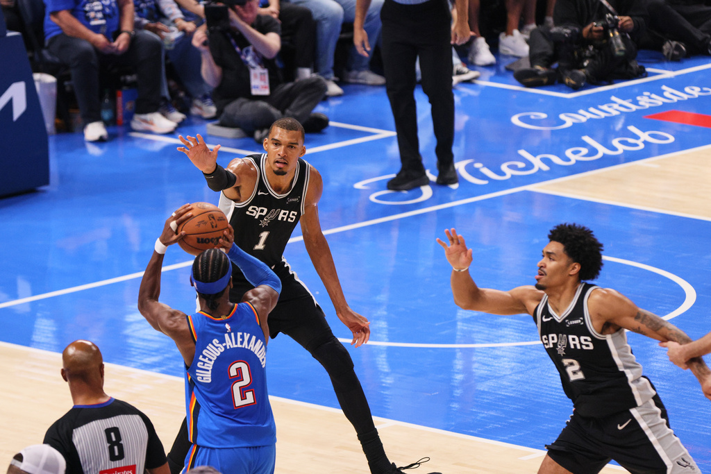 Oklahoma City Thunder guard Shai Gilgeous-Alexander (2) shoots against San Antonio Spurs forward Victor Wembanyama (1) in the second half of Game 7 of the Western Conference finals of the NBA basketball playoffs series Saturday, May 30, 2026, in Oklahoma City. (AP Photo/Nate Billings)