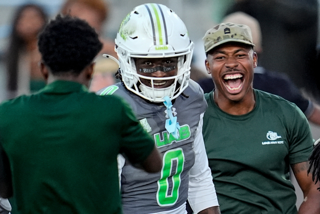 UAB wide receiver Iverson Hooks (0) celebrates his touchdown against Memphis during the second half of an NCAA college football game, Saturday, Oct. 18, 2025, in Birmingham, Ala. (AP Photo/Mike Stewart)